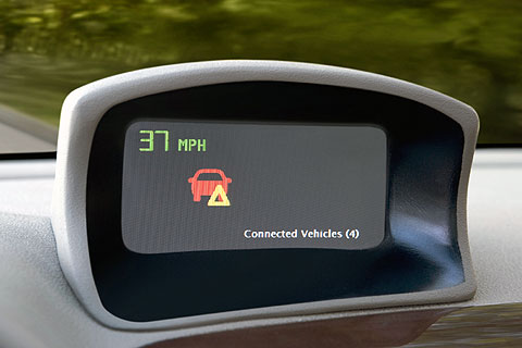  The GM display indicates that there is a vehicle ahead on the road (depicted with the red icon) and has stopped (depicted with the yellow triangle).