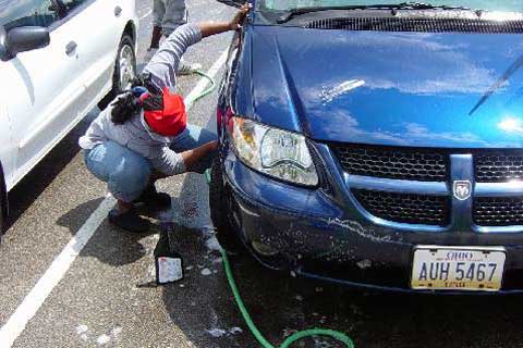 Washing a dirty car.